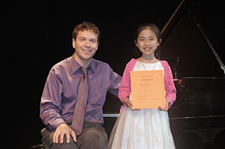 Photo Gallery of YM Piano Studio in East Windsor.  Piano Studio Gallery:  JENNIFER LIU with her teacher, pianist YEVGENY MOROZOV.